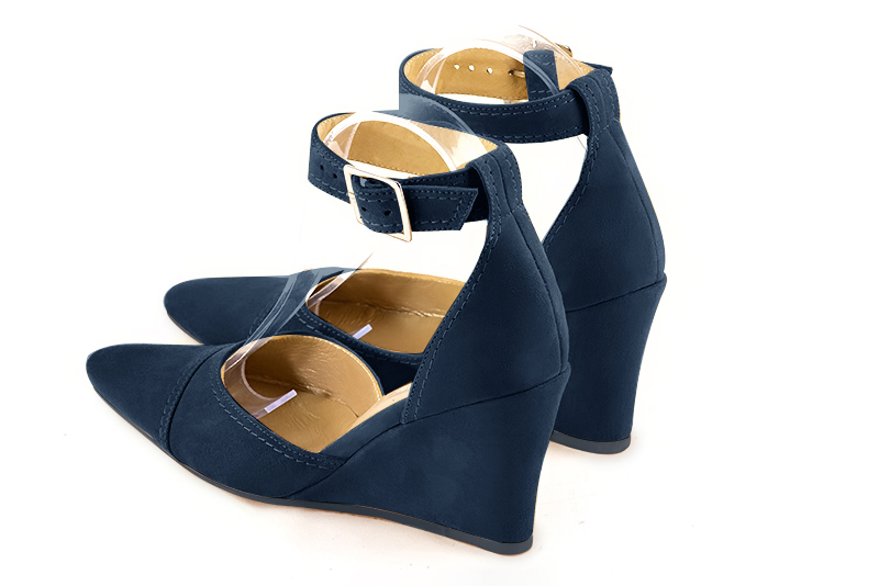 Navy blue women's open side shoes, with a strap around the ankle. Tapered toe. High wedge heels. Rear view - Florence KOOIJMAN